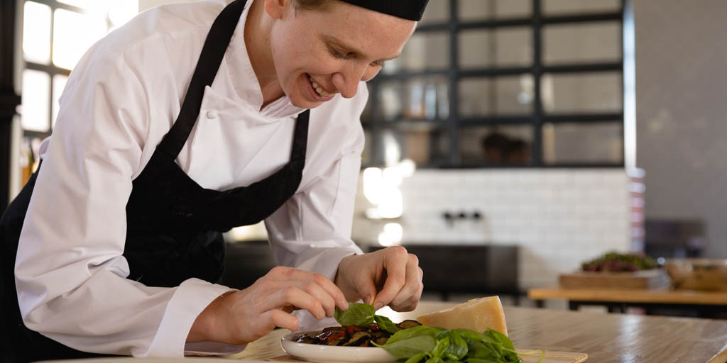 Chef dressing a plate
